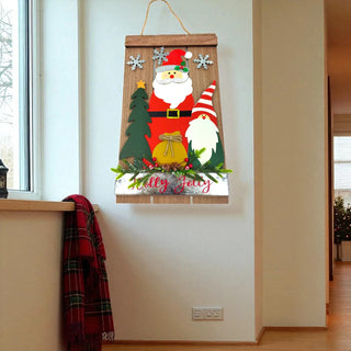 Decorative wall hanging with Santa Claus and a gnome on a wooden board, featuring the text 'olly jolly' in a home setting.