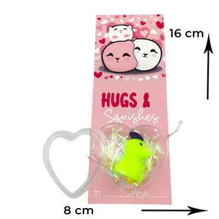 squishy toy with a heart design and pink valentines card