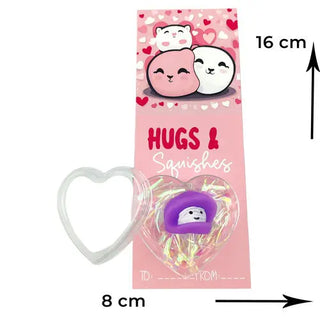 squishy toy with a heart design and pink valentines card