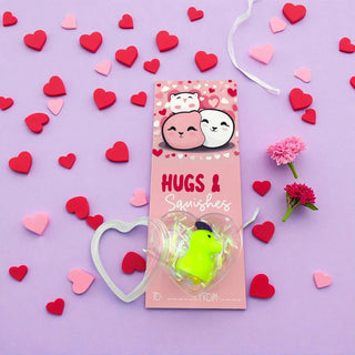 Squishy toy packaging with cartoon characters on a purple background with heart decorations
