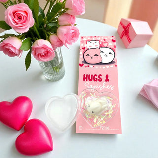 Pink 'Hugs & Sanisheets' product with a bouquet of pink roses and heart-shaped items on a white surface.