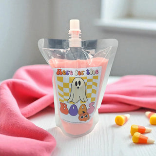 Pink pouch with a ghost design and text on a pink blanket