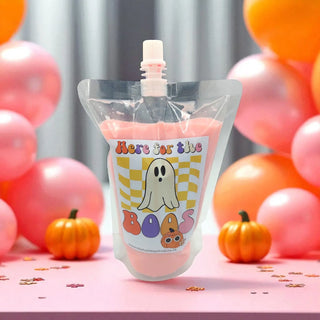 Pink pouch with ghost design labeled 'Here for the Boas' against a colorful balloon and pumpkin background