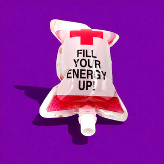 Clear energy drink package with red liquid, white cap, and 'Fill Your Energy Up!' text on a purple background.