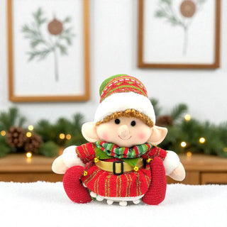 Christmas-themed elf figurine with a festive background