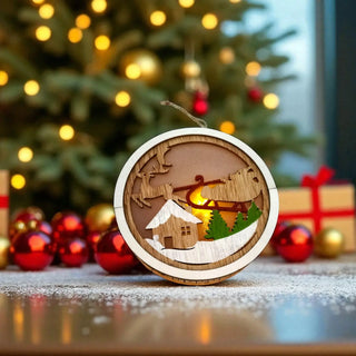 Wooden Christmas ornament with reindeer design in front of a decorated Christmas tree.
