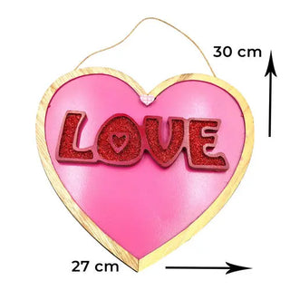 Pink wooden heart with the word love in red glitter valentines day decor
