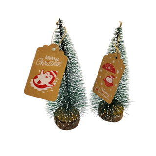 Two small Christmas trees with 'Merry Christmas' tags on a white background