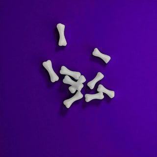 Mini White bones on a purple background