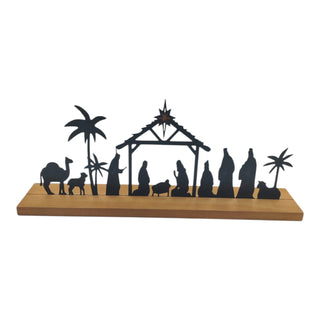 Silhouette nativity scene with wooden base on a white background