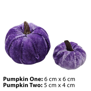 Two purple velvet pumpkins with measurements on a white background