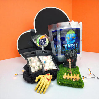 Ghoulishly themed items including a zombie hand, candy, and decorative elements on an orange background.
