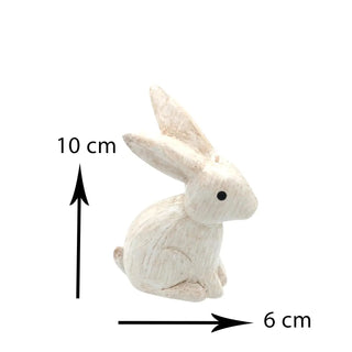 Small white rabbit figurine with measurements on a white background