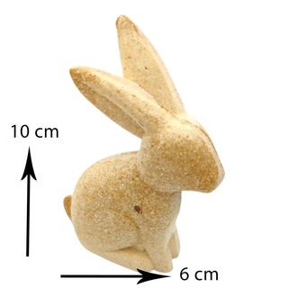 Small rabbit figurine with measurements on a white background