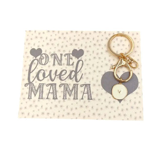 Keychain with heart charm on a card that says 'One Loved Mama' on a white background