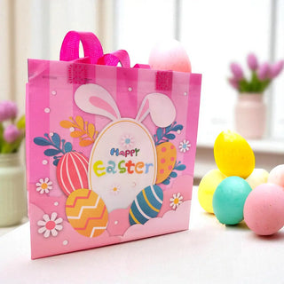 Pink Easter gift bag with bunny ears and colorful eggs on a light background