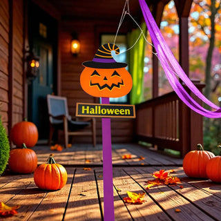 Halloween-themed decoration with pumpkins and a sign on a wooden porch.