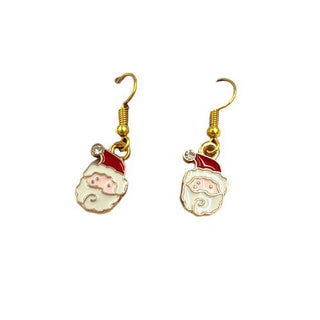 metal santa earrings on a christmas background