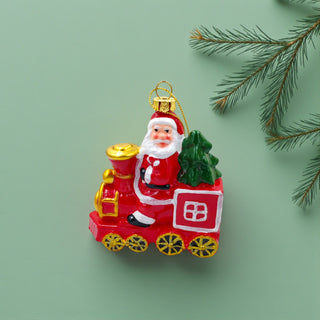 Christmas ornament featuring Santa Claus on a train with a green tree, on a white background. Classic Aesthetic for Christmas