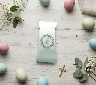 Green and white product packaging with floral design on a wooden surface with Easter eggs and flowers.