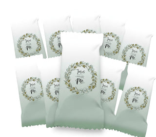 Packaged snacks with 'Jesus Saved Me' text and wreath design on a white background