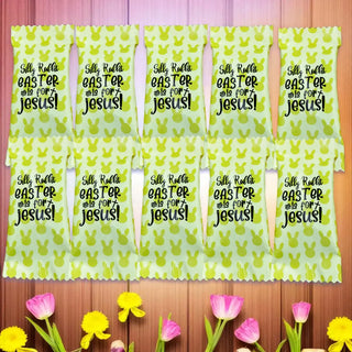 Silky Raffia Easter tablecloth with bunny pattern and text on a wooden surface with flowers.