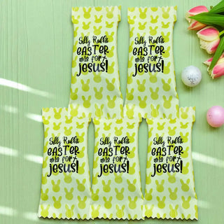 Five yellow Easter bags with text on a green surface with tulips and eggs.