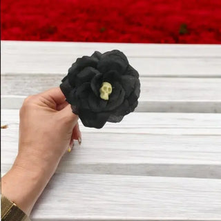 black rose with black stem and yellow center