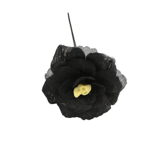 Black flower with yellow center on a white background