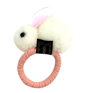 Plush bunny toy with a pink ring on a white background