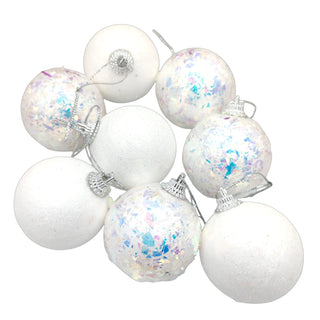 Set of white Christmas ornaments with colorful speckles on a white background, dreamy Christmas look