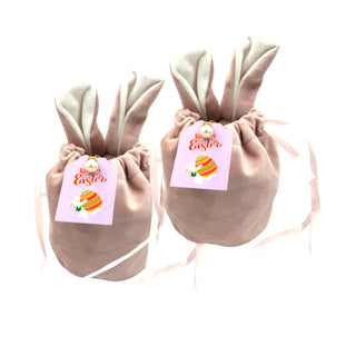 Two beige bunny ears bags with 'Happy Easter' tags on a white background