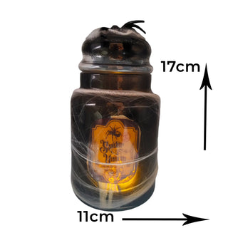 Decorative bottle with spider web design and measurement indicators on a white background
