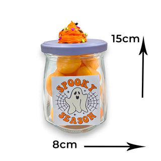 Glass jar with Halloween-themed label and candy, labeled dimensions on a white background