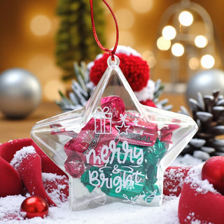 Star-shaped clear ornament with 'Merry & Bright' text, surrounded by Christmas decorations.