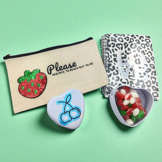 Berry-themed gift set with pink and purple packaging, ideal for fruity gift lovers on a green background