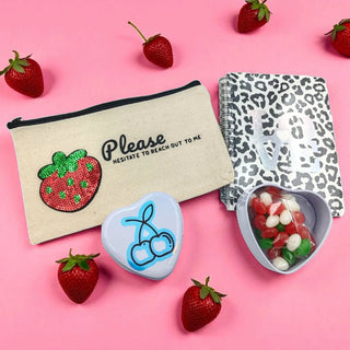 Berry-themed gift set with pink and purple packaging, ideal for fruity gift lovers on a pink background