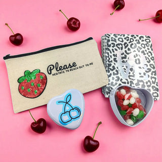 Berry-themed gift set with pink and purple packaging, ideal for fruity gift lovers on a pink background