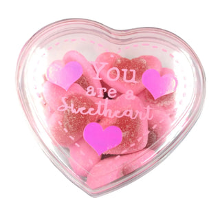 Heart-shaped container with pink gummy hearts and 'You are a sweetheart' text on a white background