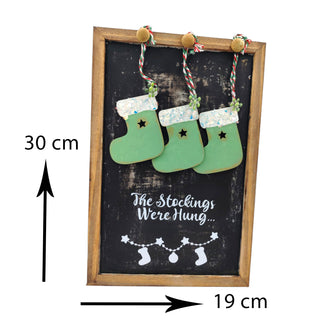 Decorative sign with stockings and text on a blackboard, showing dimensions.