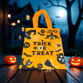 Halloween-themed trick or treat bag with pumpkins and a haunted house in the background