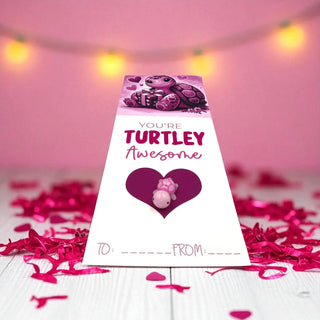 Valentine's Day card with turtle design and 'You're Turtley Awesome' text on a pink background.