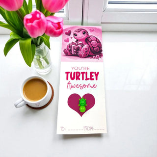 Valentine's Day card with turtle design, coffee, and tulips on a white surface