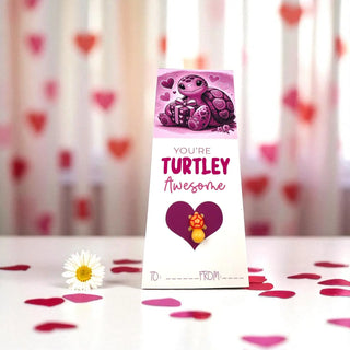 Valentine's Day card with turtle illustration and heart design on a pink background