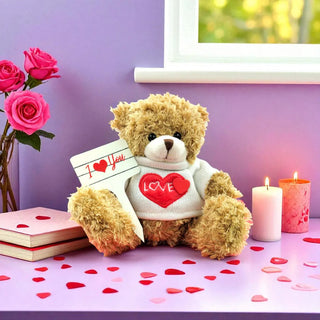 Teddy bear holding a 'I Love You' card with pink roses and candles on a purple background