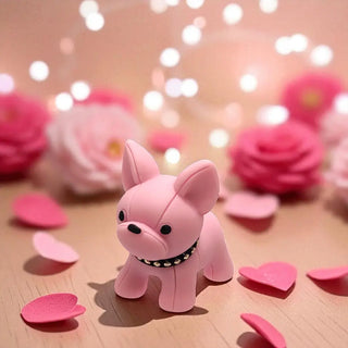 Pink dog figurine with heart-shaped petals and flowers on a wooden surface