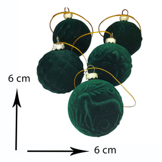 Green velvet ornaments with gold loops and measurements on a white background