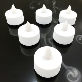 White LED candles on a black background