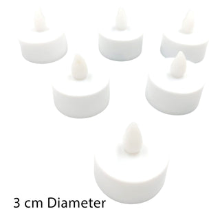 Set of six white candles with a 3 cm diameter on a white background