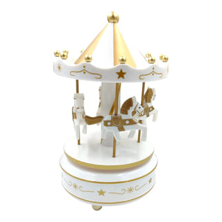 Decorative carousel with white horses and gold accents on a white background